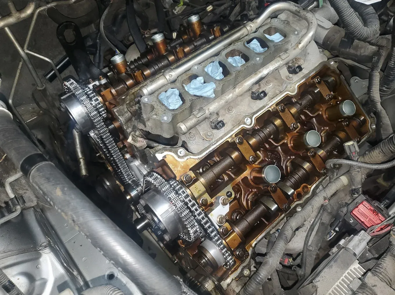 Cylinder head and valvetrain exposed during engine repair